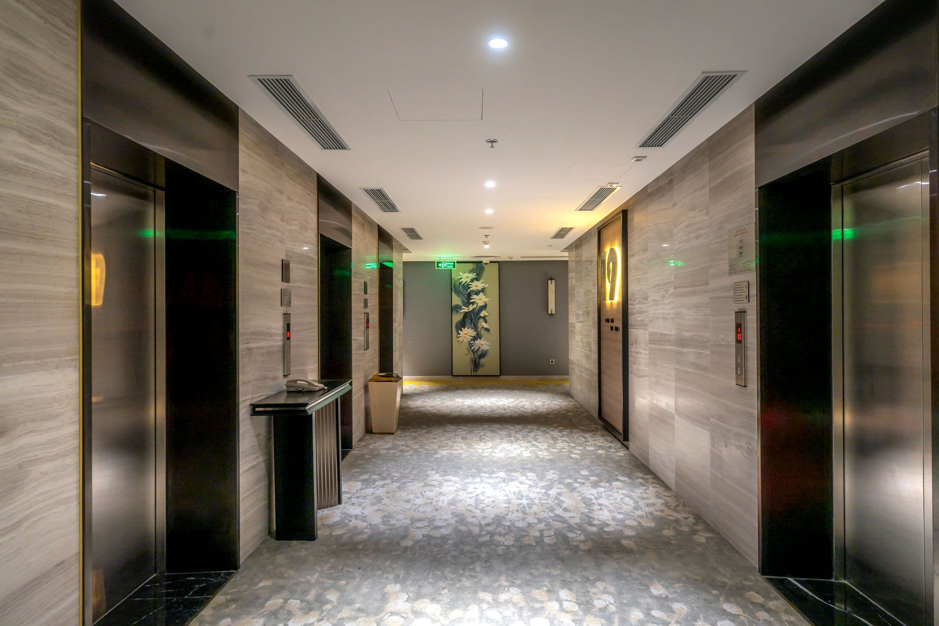 A modern hotel hallway with elevators